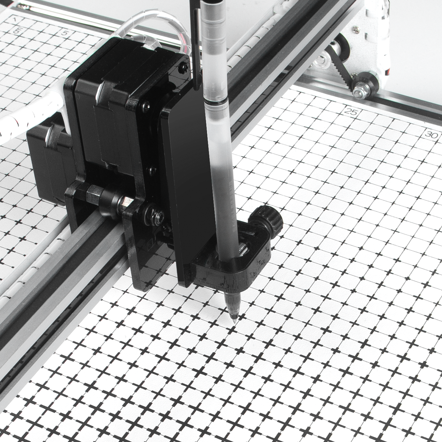 PaxieBot Plotter A3 machine tool with a pen on a grid surface