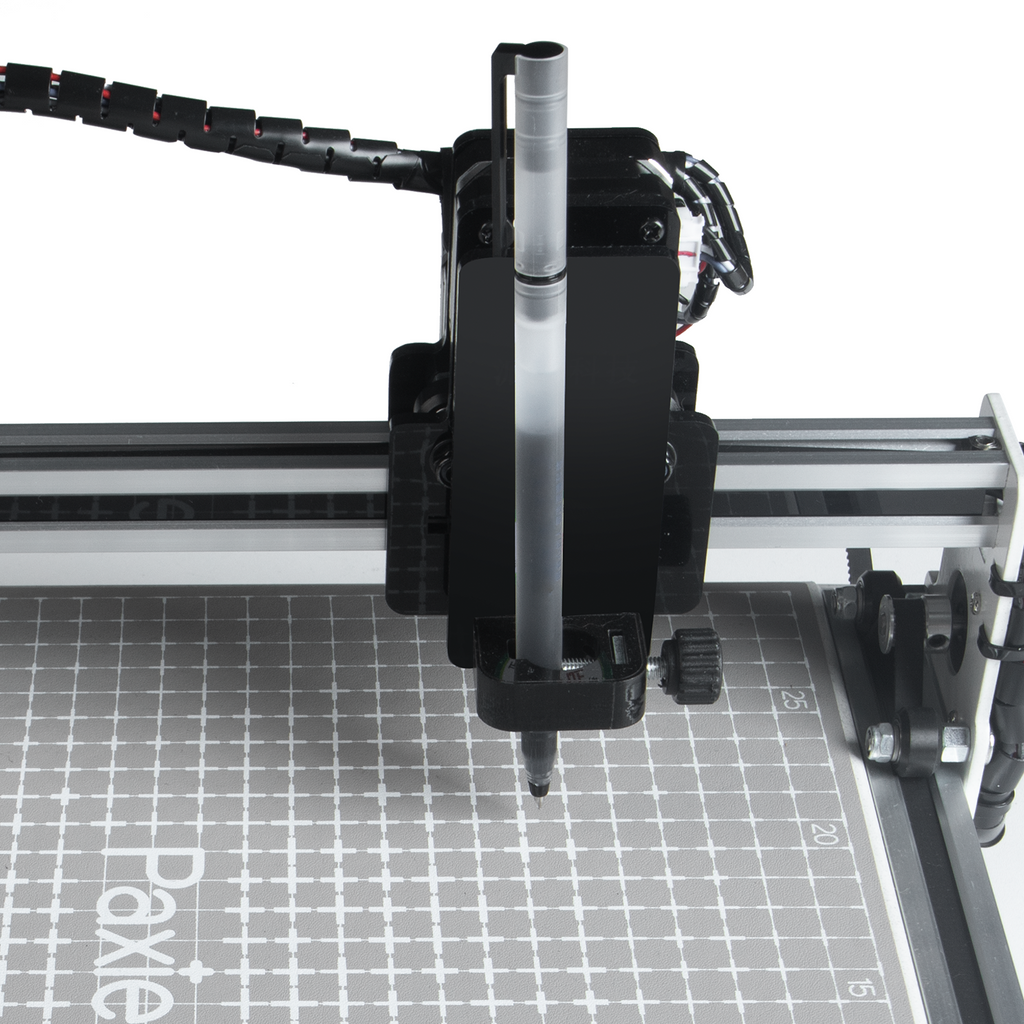 PaxieBot Smart Handwriting Machine on a grid surface with 'Paxie' branding